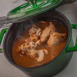 Seafood Medley (soup) served with bread rolls